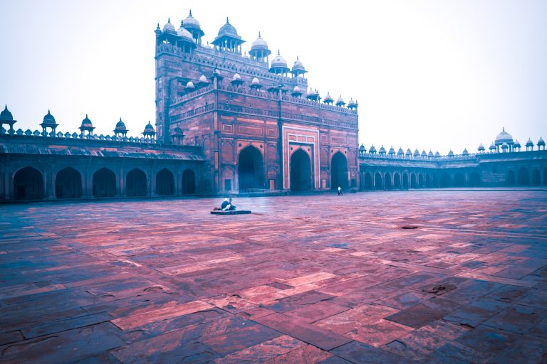 They must be cooking something. Against the Buland Darwaza, Fatehpur, India