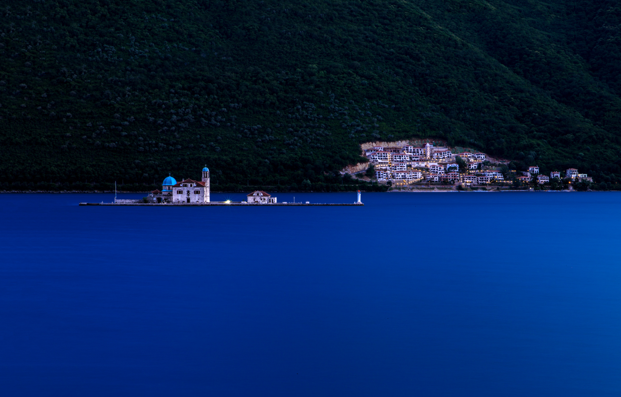 Our Lady of the Rocks church on an islet in Kotor Bay at dusk