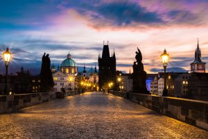 A smattering of photographers on a cold wintry morning on Charles Bridge in Prague